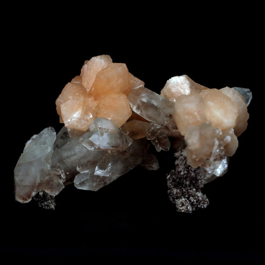 Terminated Stilbite with Apophyllite Natural Mineral Specimen # B 480…  https://www.superbminerals.us/products/terminated-stilbite-with-apophyllite-natural-mineral-specimen-b-4802  Features: Beautiful, classic salmon-pink, iridescent, translucent stilbite blades form a dramatic and sculptural huge two-sided specimen from Jalgaon, with sprakling Apophyllite crystals.The huge doubly ended bowtie on the back is eye-catching. The wormy, green celadonite-infused chalcedony matrix 